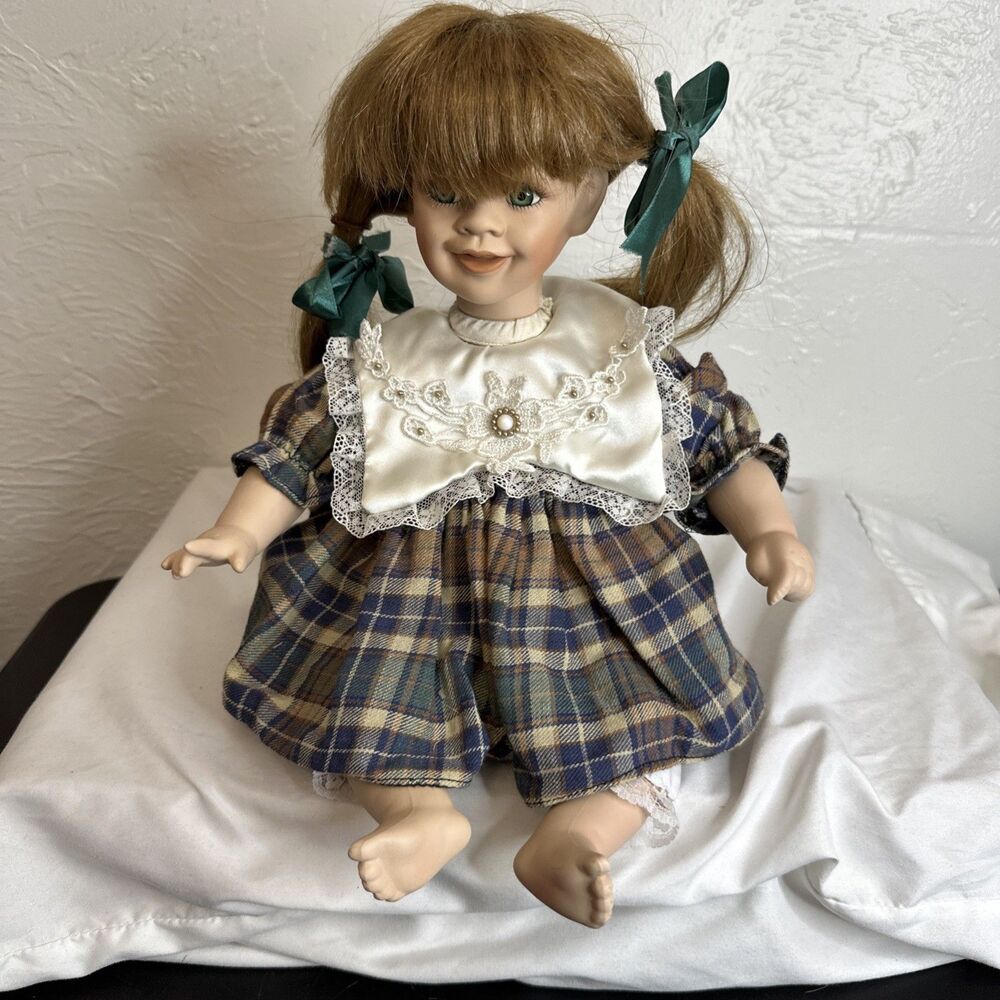 PORCELAIN DOLL PLAID SKIRT-SITTING-10" TALL